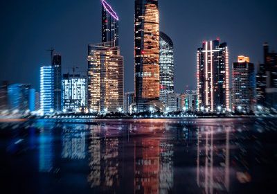 Skyline,Of,Abu,Dhabi,At,Night,With,Water,Reflection!