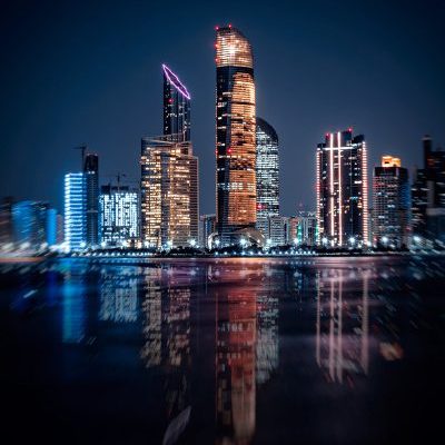 Skyline,Of,Abu,Dhabi,At,Night,With,Water,Reflection!